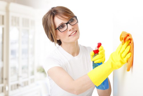 Careful cleaning of polished wood flooring in Mayfair